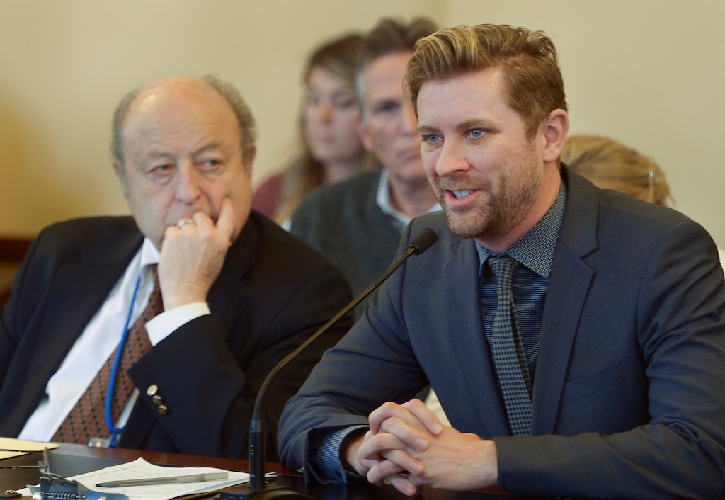 (Leah Hogsten | Tribune file photo) In this Feb. 7, 2018, file photo, Sen. Lyle Hillyard, R-Logan, (right) listens as Equality Utah executive director Troy Williams gives his reasons not to repeal Utah's surrogacy law in the Senate Health and Human Services Committee at the Capitol. "The LGBTQ community asks for equal access and equal protection under the law," said Williams regarding the bill.