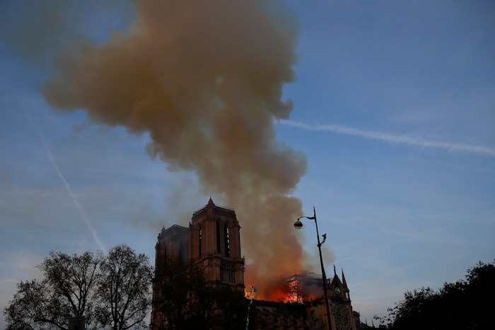 Notre Dame cathedral is burning in Paris, Monday, April 15, 2019. A catastrophic fire engulfed the upper reaches of Paris' soaring Notre Dame Cathedral as it was undergoing renovations Monday, threatening one of the greatest architectural treasures of the Western world as tourists and Parisians looked on aghast from the streets below. (AP Photo/Francois Mori)