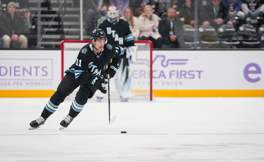 (Bethany Baker  |  The Salt Lake Tribune) Utah Hockey Club right wing Dylan Guenther (11) brings the puck down the ice during the game at the Delta Center in Salt Lake City on Friday, Nov. 29, 2024.