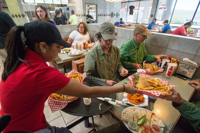 (Rick Egan  |  The Salt Lake Tribune)  Elizabeth Nava delivers food to customers at The Silver Summit Cafe, on Silver Creek Drive in Park City.