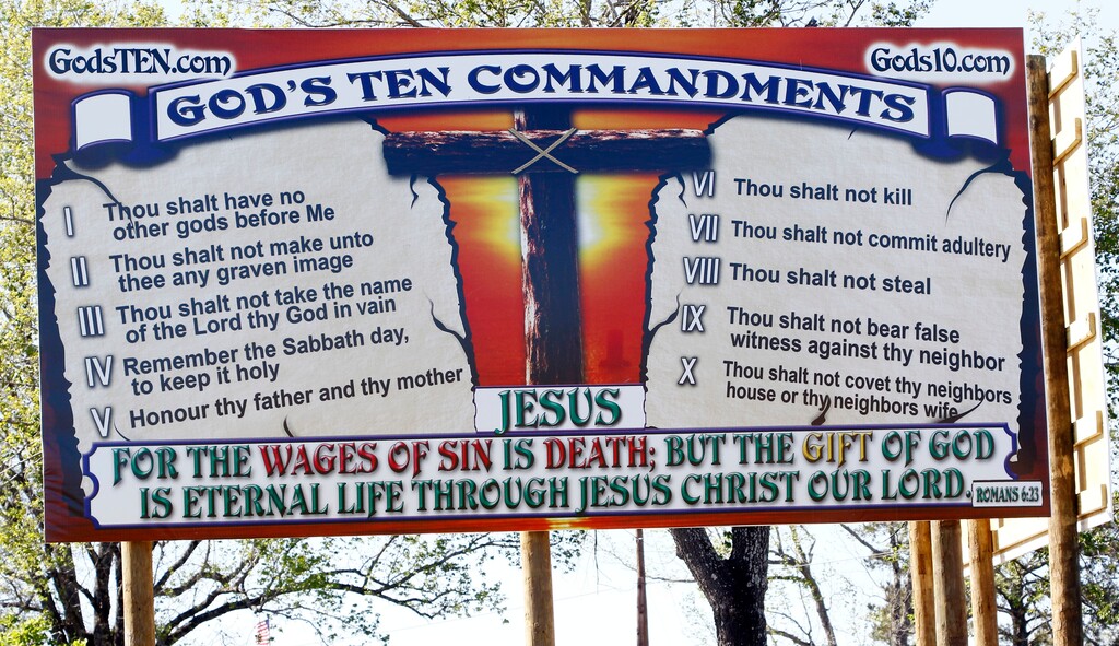 This Wednesday, March 21, 2018 photo shows a billboard displaying the Ten Commandments which Wayne Wallace installed without proper permits in Brookhaven, Miss. (AP Photo/Rogelio V. Solis)