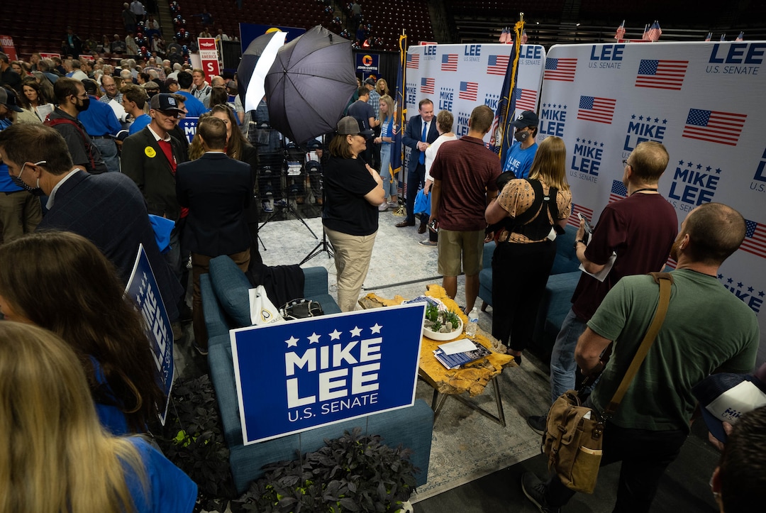 (Francisco Kjolseth | The Salt Lake Tribune) Sen. Mike Lee draws a crowd as delegates line up for a hand shake and a photo as they attend the Utah Republican Party’s 2021 Organizing Convention at the Maverik Center in West Valley City on Saturday, May 1, 2021.