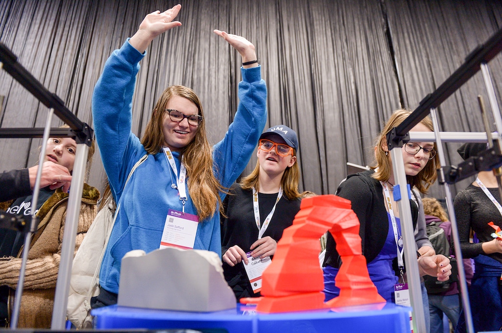 (Leah Hogsten | The Salt Lake Tribune) l-r Northridge High School students Jade Safford and Autumn Colbert react as they play with 3D printed toys at ReliaBuild 3D's booth at SheTech Explorer Day for high school and middle school girls to learn and explore the world of science and math — including, coding, robotics, building circuits, diamond cutting, artificial intelligence and virtual reality at the Mountain America Expo Center in Sandy, Thursday, March 1, 2018.