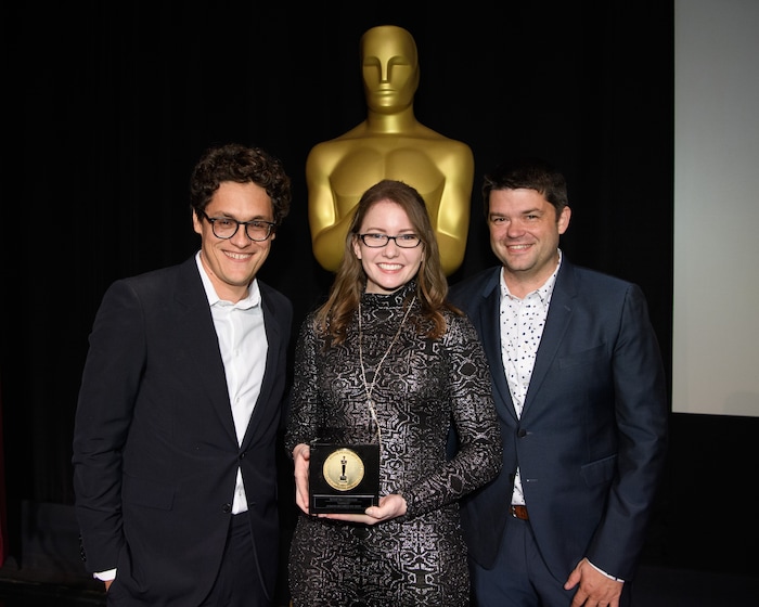 (Photo courtesy of Todd Wawrychuk | AMPAS) Kalee McCollaum, center, director of the animated short film "Grendel," holds her Student Academy Award Gold Medal, alongside presenters Phil Lord, left, and Chris Miller, after a ceremony in Beverly Hills, Calif, on Thursday, Oct. 17, 2019. The film was made by students at Brigham Young University's Center for Animation.