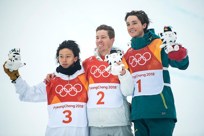 (Chris Detrick  |  The Salt Lake Tribune)  USA's Shaun White celebrates winning gold with Japan's Ayumu Hirano and Australia's Scotty James during the men's halfpipe finals at Phoenix Snow Park during the Pyeongchang 2018 Winter Olympics Wednesday, Feb. 14, 2018.  White won the event with a 97.75, his third Olympic gold medal in the halfpipe (2006, 2010, 2018).