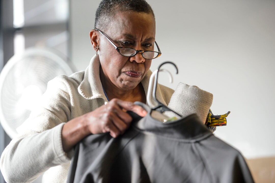(Steve Griffin  |  The Salt Lake Tribune)  Erma Decaria, a volunteer at Volunteers of America, sorts clothing that has been donated to help homeless young people in Salt Lake in Salt Lake City Monday December 11, 2017.