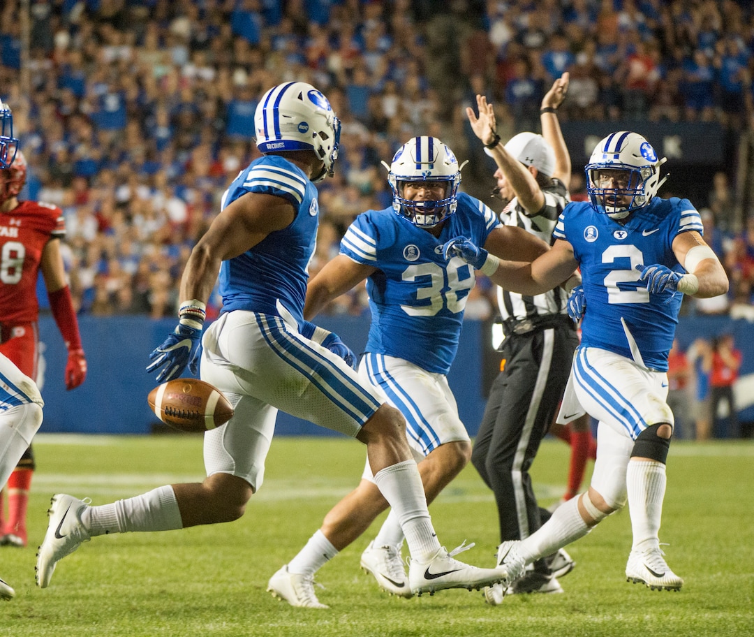 (Rick Egan  |  The Salt Lake Tribune) The Brigham Young Cougars celebrate after  linebacker Fred Warner (4) recoverd a fumble by Utah quarterback Tyler Huntley (1), in football action BYU vs Utah, at Lavell Edwards Stadium in Provo, Saturday, September 9, 2017.