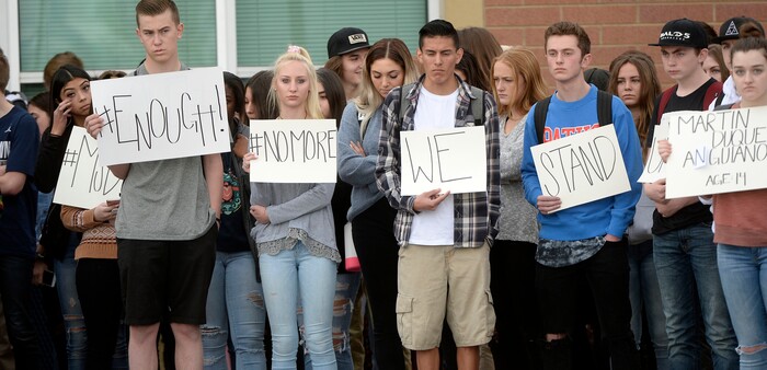 (Al Hartmann  |  The Salt Lake Tribune) 	
About 80 students at Westlake High School in Saratoga Springs left class and stood together in silence at the front entrance of the school Wednesday March 14, 2018 to remember the 17 students who died in a school shooting in Florida.  They held posters of the names of those killed. 