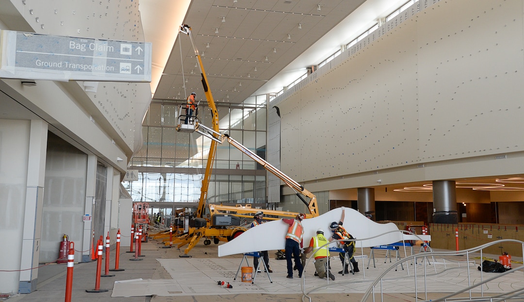 (Francisco Kjolseth  |  The Salt Lake Tribune) The area known as The Canyon begins to take shape with crews stretching fabric over metal fins to simulate southern Utah canyon walls as crews continue their work in the first phase of construction of the Salt Lake City International Airport on Wednesday, May 20, 2020.