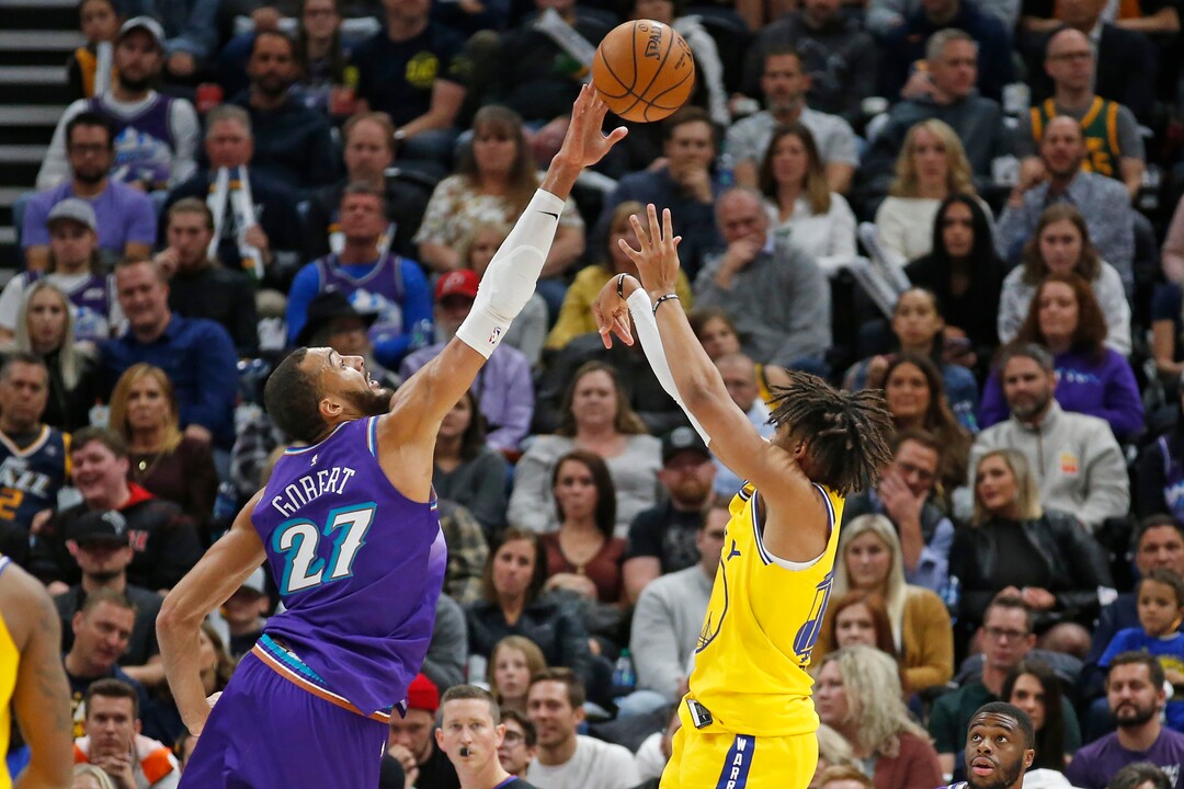 Utah Jazz center Rudy Gobert (27) blocks the shot of Golden State Warriors guard Jordan Poole during the second half during an NBA basketball game Friday, Nov. 22, 2019, in Salt Lake City. (AP Photo/Rick Bowmer)