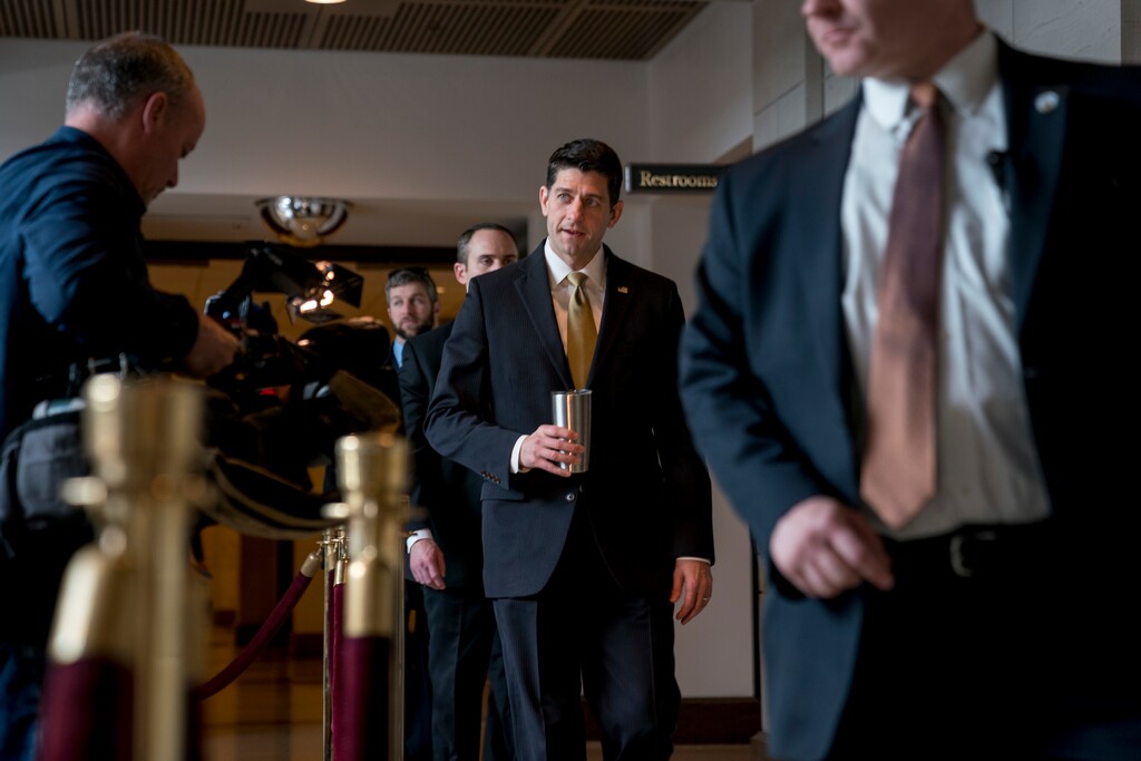 House Speaker Paul Ryan of Wis., center, walks to the Capitol Building from the Capitol Visitor's Center, Thursday, Jan. 18, 2018, in Washington. (AP Photo/Andrew Harnik)