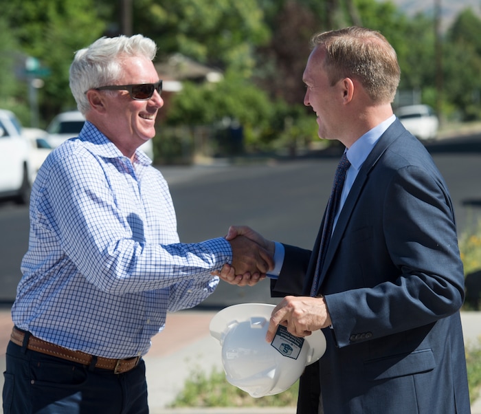 (Rick Egan  |  The Salt Lake Tribune)     Mark Isaac, Principal, Pinyon8 Consulting LLC shakes hands with Salt Lake County Mayor Ben McAdams,  after the ground breaking ceremony of UTA’s S-Line double track project, on 300 East and 2233 South, Monday, June 11, 2018.