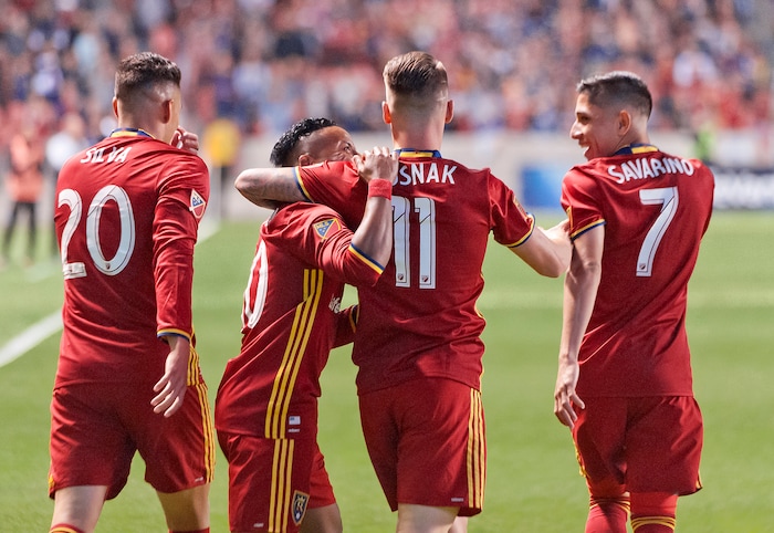 (Michael Mangum  |  Special to the Tribune)  Real Salt Lake midfielder Luis Silva (20), left, Joao Plata (10), midfielder Albert Rusnak (11) and midfielder Jefferson Savarino (7) celebrate Rusnak's first half goal during their MLS match against the Portland Timbers at Rio Tinto Stadium in Sandy, UT on Saturday, September 16, 2017.