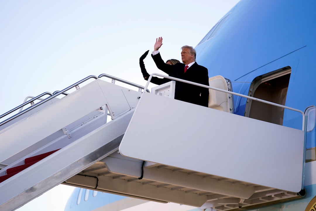 President Donald Trump and first lady Melania Trump board Air Force One at Andrews Air Force Base, Md., Wednesday, Jan. 20, 2021.(AP Photo/Manuel Balce Ceneta)