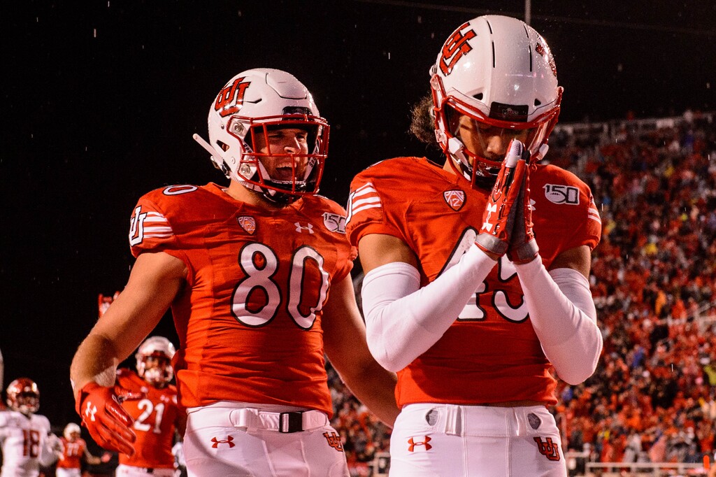 (Trent Nelson  |  The Salt Lake Tribune)  Utah Utes wide receiver Samson Nacua (45) celebrates a touchdown as the Utah Utes host the Washington State Cougars, NCAA football at Rice-Eccles Stadium in Salt Lake City on Saturday Sept. 28, 2019. At left is Utah Utes tight end Brant Kuithe (80).