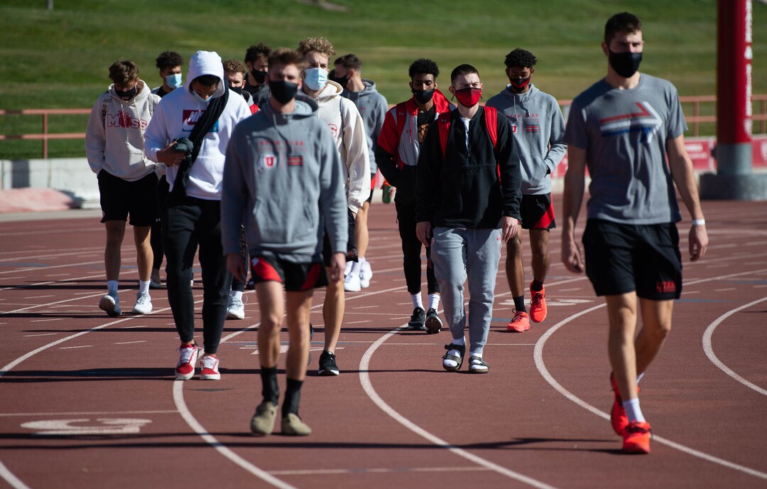 (Francisco Kjolseth  |  The Salt Lake Tribune) University of Utah basketball players walk in honor of Lauren McCluskey on the two-year anniversary of her murder, as they as they gather on the track where she used to compete on Thursday, Oct. 22, 2020.