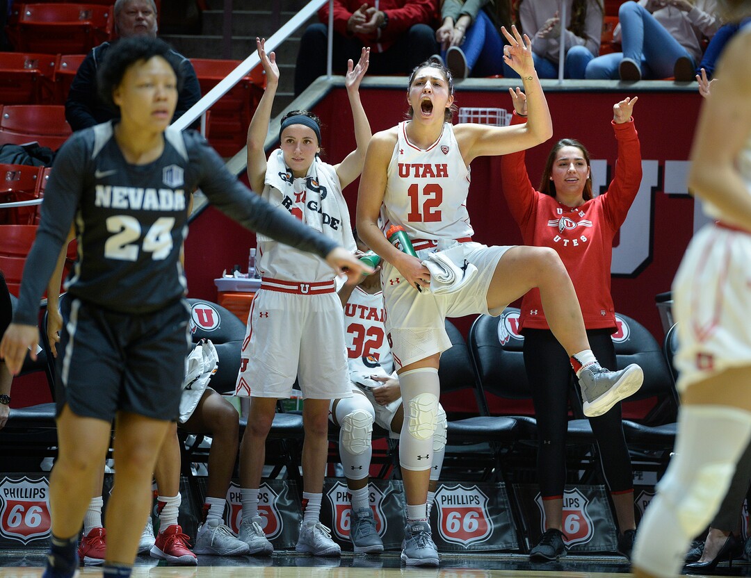 (Scott Sommerdorf   |  The Salt Lake Tribune)   Utah's Emily Potter celebrates a made three-point shot by Tori Williams during second half play. The Utah women beat Nevada 87-61, Friday, November 10, 2017. 