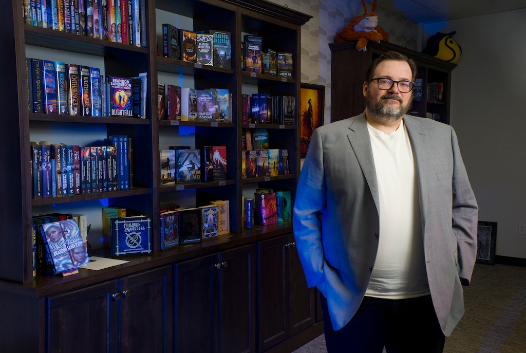 (Bethany Baker  |  The Salt Lake Tribune) Brandon Sanderson, a popular fantasy author based out of Utah, stands for a portrait at the headquarters for his company Dragonsteel Entertainment in Pleasant Grove on Thursday, July 16, 2026.