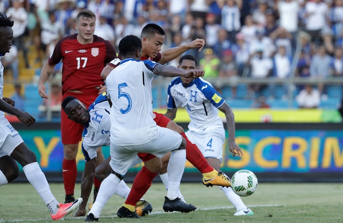 United States' Bobby Wood, 9, kicks the ball to score his team's first goal during a 2018 World Cup qualifying soccer match against Honduras in San Pedro Sula, Honduras, Tuesday, Sept. 5, 2017. (AP Photo/Rebecca Blackwell)