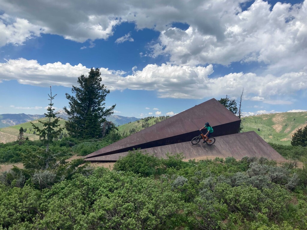(Leia Larsen | The Salt Lake Tribune) Ryan Lauck rolls over the Paper Airplane sculpture at Powder Mountain on June 8, 2021.