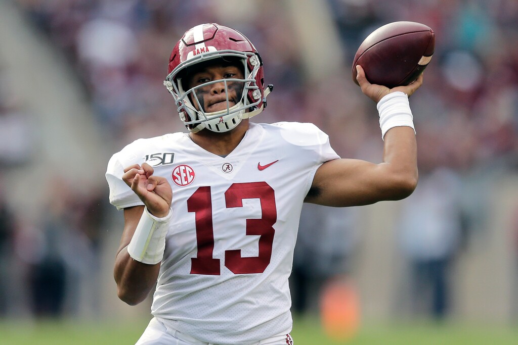 FILE - In this Oct. 12, 2019, file photo, Alabama quarterback Tua Tagovailoa passes against Texas A&M during the second half of an NCAA college football game in College Station, Texas. A high-stakes tilt between LSU and Alabama could prove as pivotal in Heisman Trophy voting as it is in providing the winner an inside track to the College Football Playoff. (AP Photo/Sam Craft, File)