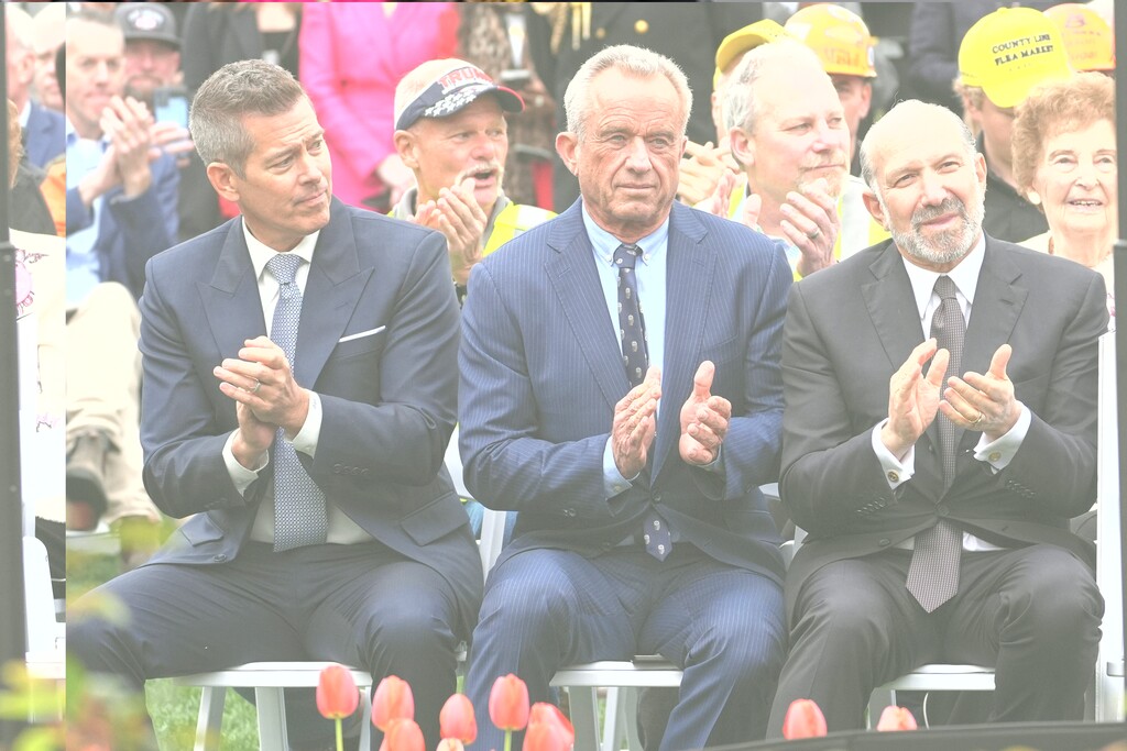 Transportation Secretary Sean Duffy, left, Health and Human Services Secretary Robert F. Kennedy Jr. and Commerce Secretary Howard Lutnick listen as President Donald Trump speaks during an event to announce new tariffs in the Rose Garden of the White House, Wednesday, April 2, 2025, in Washington. (AP Photo/Evan Vucci)