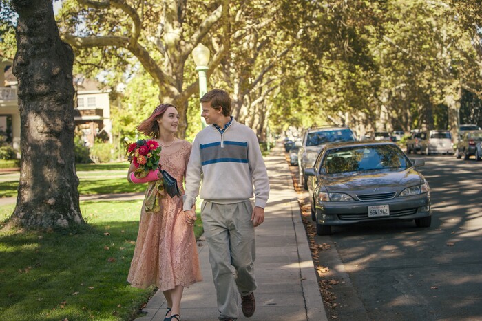 This image released by A24 Films shows Saoirse Ronan, left, and Lucas Hedges in a scene from "Lady Bird." (Merie Wallace/A24 via AP)