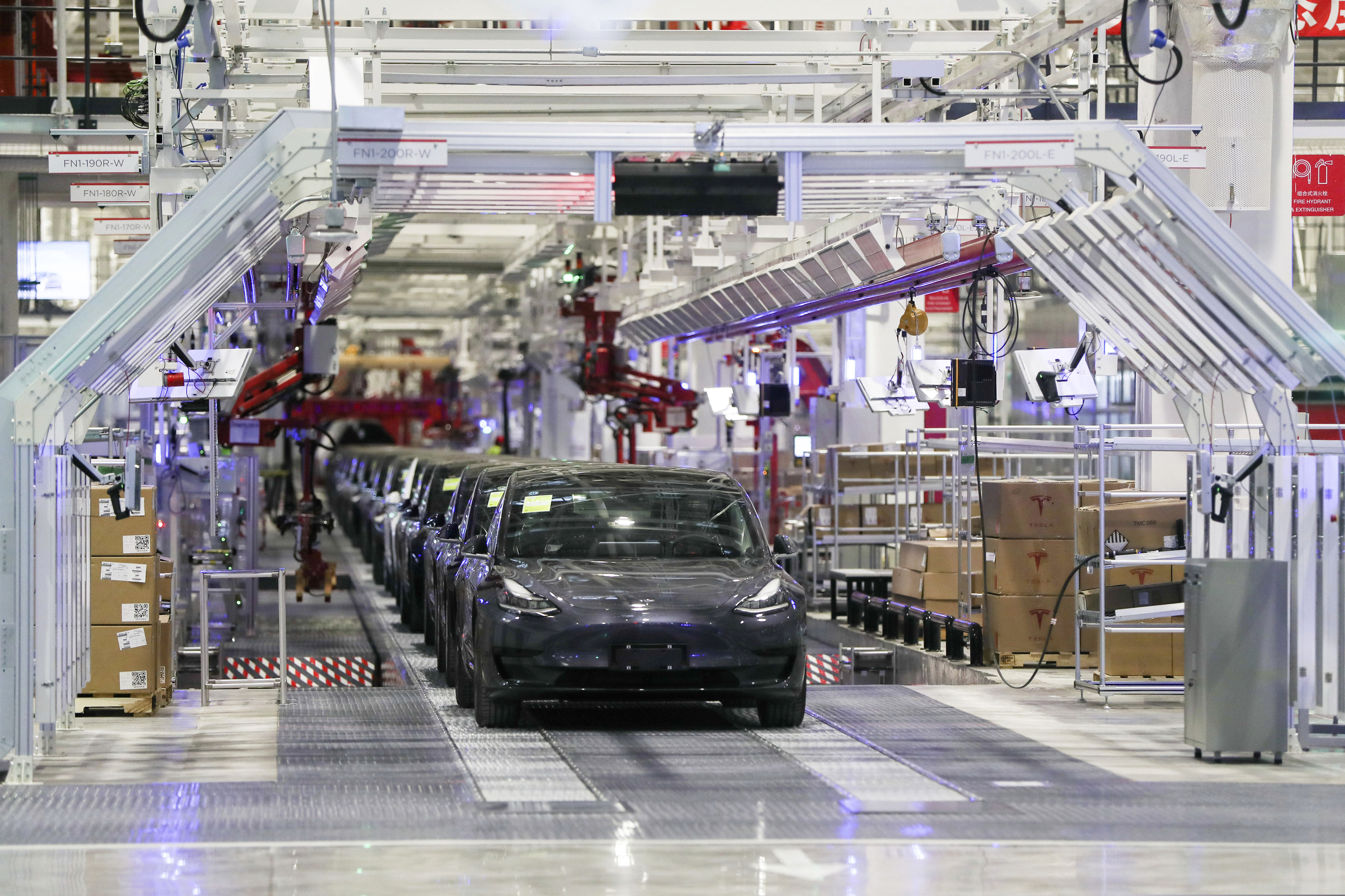 (Ding Ting | Xinhua via AP) In this photo released by China's Xinhua News Agency, Tesla vehicles are seen on an assembly line at Tesla's gigafactory in Shanghai, Tuesday, Jan. 7, 2020.