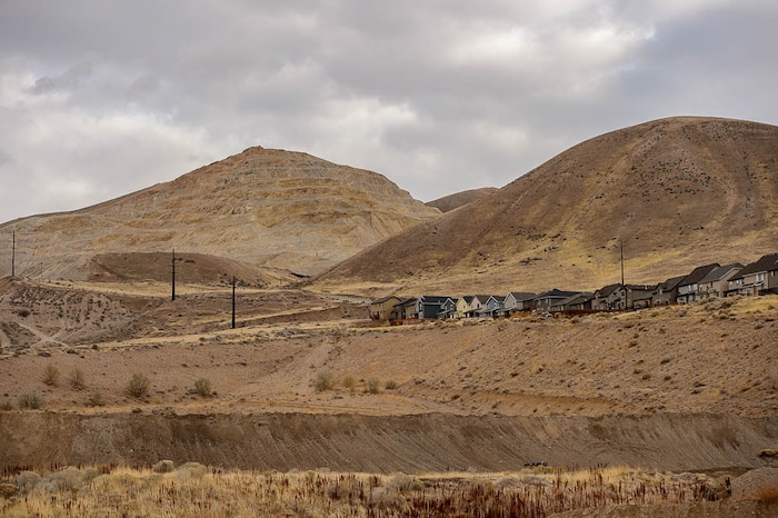 (Trent Nelson | The Salt Lake Tribune)
Homes at Traverse Ridge near a mining operation, Friday Nov. 23, 2018. The city of Lehi has sent a letter of assurance to residents saying there are no health risks from the gravel mining and construction on Point of the Mountain. They site a health department study showing the operation is not causing health-damaging air pollution. The health department tells a different story -- and they can't say there are no health risks from the mining.