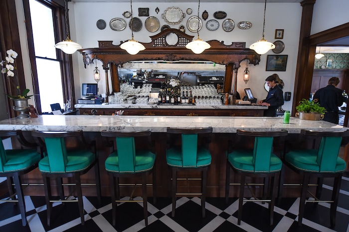 (Francisco Kjolseth  |  The Salt Lake Tribune)  Caffe Molise recently opened in its new location inside the old (but completely updated) Eagle Building on the southwest corner of 400 South and West Temple. The wood frame and mirror in the bar was salvaged from the old Dead Goat  Saloon where owners Aimee Sterling and Fred Moesinger met. 