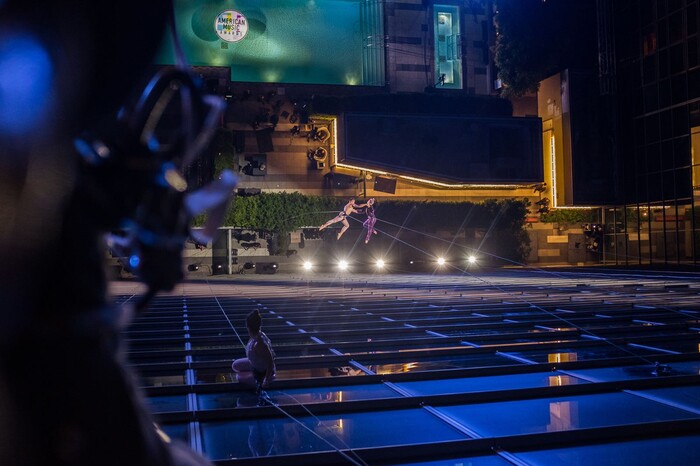 (Photo courtesy of Basil Tsimoyianis) Oakland, Calif.-based “vertical dance” company BANDALOOP performs with pop star P!nk on the JW Marriott building in Los Angeles at the 2017 American Music Awards. BANDALOOP will be appearing at the Utah Arts Festival June 21-24, and will perform twice daily (5:30 and 7 p.m.) on the six-story library glass wall above the reflecting pool.