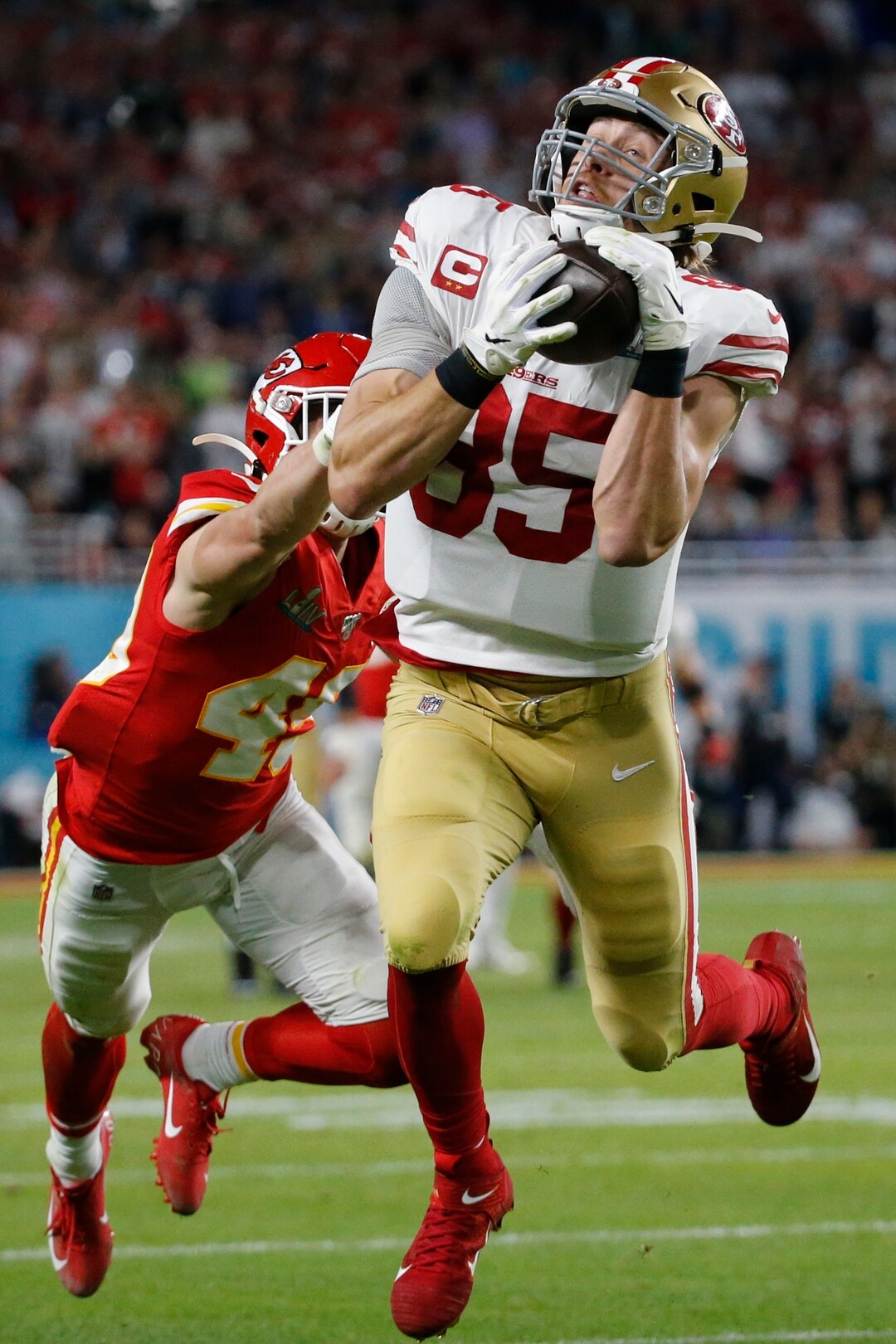 San Francisco 49ers' George Kittle (85) catches a pass in front of Kansas City Chiefs' Daniel Sorensen during the first half of the NFL Super Bowl 54 football game Sunday, Feb. 2, 2020, in Miami Gardens, Fla. The play was called back on a penalty by Kittle. (AP Photo/Mark Humphrey)