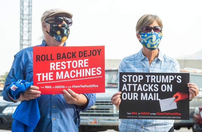 (Rick Egan  |  The Salt Lake Tribune)     Katie and Steve Pappas join protesters during a rally to "Save the Post Office," hosted by Alliance for a Better Utah, NAACP Salt Lake Branch, League of Women Voters at the Post Office on 200 South in Salt Lake City, Saturday, Aug. 22, 2020.