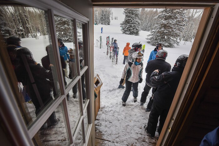 (Francisco Kjolseth | The Salt Lake Tribune) As a day of carving turns comes to a close, skiers congregate at the Sunset Cabin near the top of Deer Valley Resort for an only ski-in, ski-out Friday afternoon Shabbat, the Jewish Sabbath service. Held during the winter season Rabbi David Levinsky altered the prayer in the Amidah that calls for "wind and rain" to "wind and snow." Jan. 26, 2018.