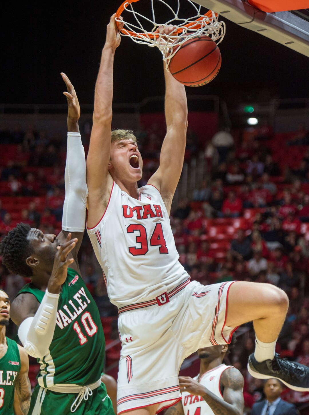 (Rick Egan  |  The Salt Lake Tribune)    Utah Utes center Jayce Johnson (34) dunks the ball, as Mississippi Valley State Delta Devils center Emmanuel Ejeh (10) defends, in basketball action between Utah Utes and Mississippi Valley State Delta Devils at the Jon M. Huntsman Center, Thursday, Nov. 15, 2018.