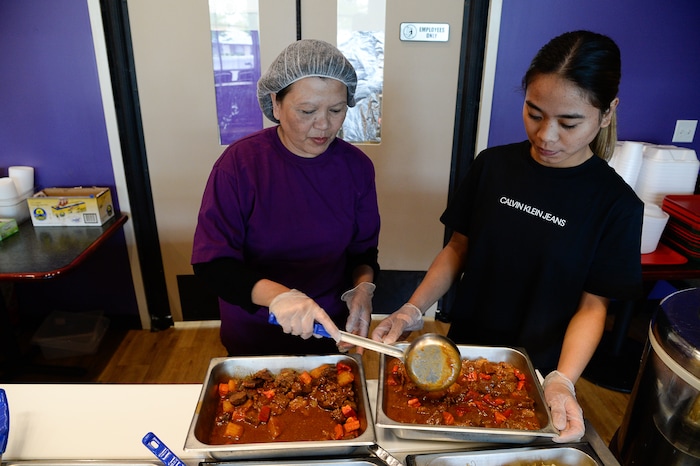 (Francisco Kjolseth  |  The Salt Lake Tribune)  Yaye Sherer, left, and Arlene Orani make sure the lunch options fully stocked at BFF Turon, a new Filipino restaurant in West Jordan that serves up turo-turo or cafeteria style food.