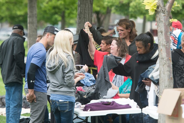 (Rick Egan  |  The Salt Lake Tribune)      
The Salt Lake City Mission distributes clothes to the homeless in Pioneer Park on Memorial day, Monday, May 28, 2018.


 