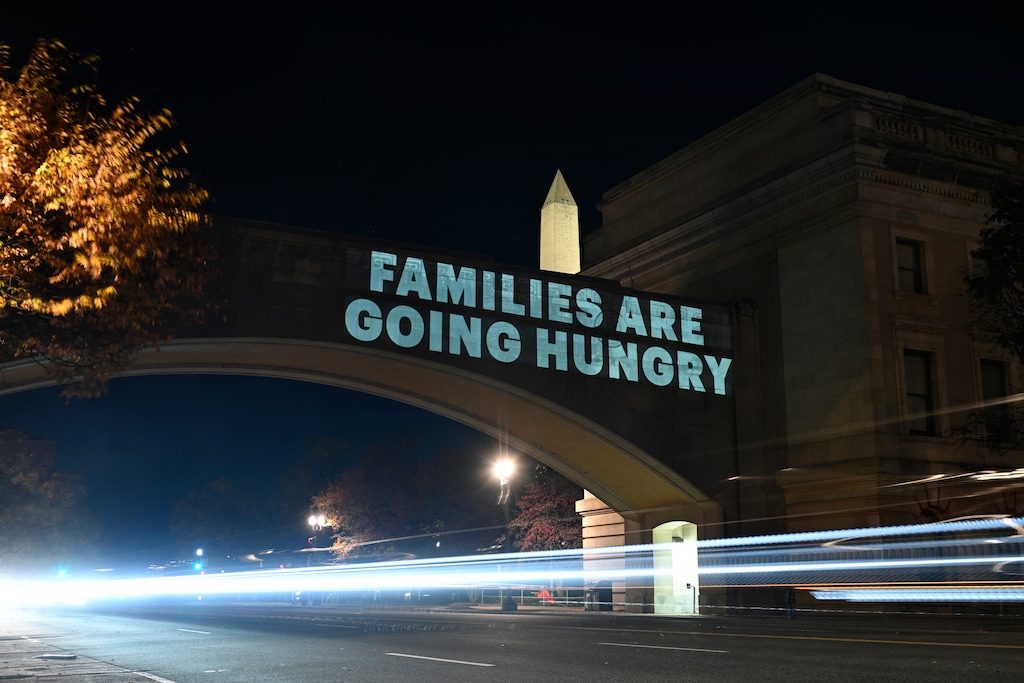 (John McDonnell | AP Photo) A message from the National Women's Law Center concerning the announcement by the Trump administration of restoring only half funding the SNAP benefits is projected on the U.S. Department of Agriculture building, Monday, Nov. 3, 2025, in Washington.