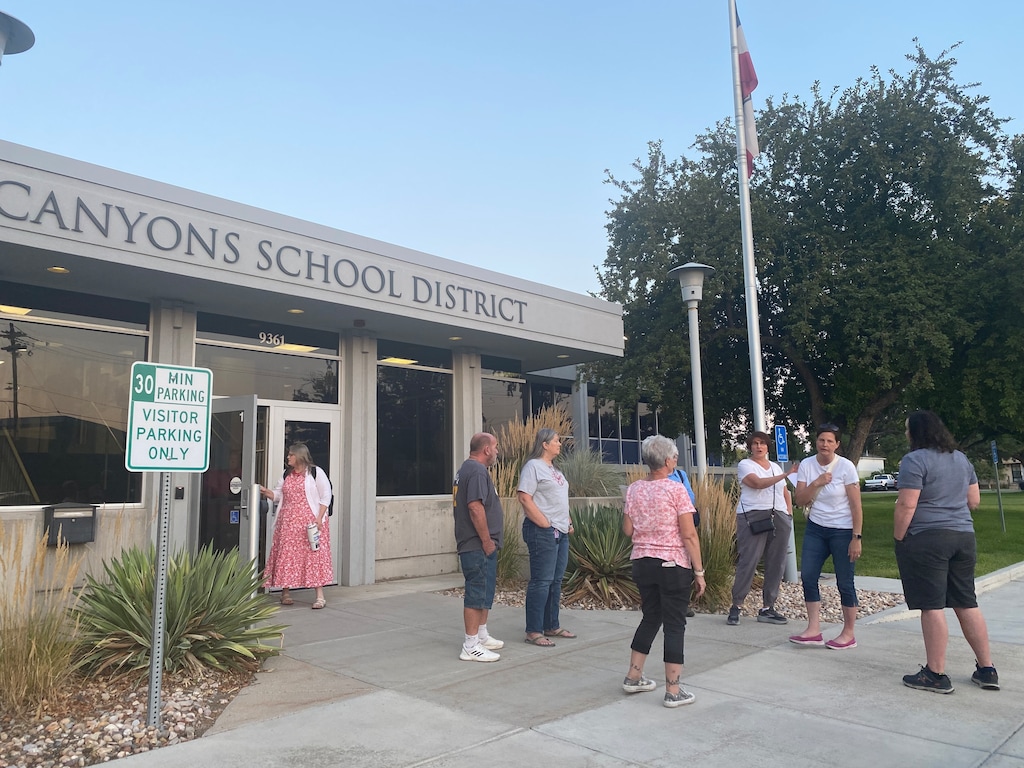 (Sorina Szakacs| The Salt Lake Tribune)  Residents gather in front of the Canyons School District after the board meeting to increase property taxes on Aug. 5, 2025.