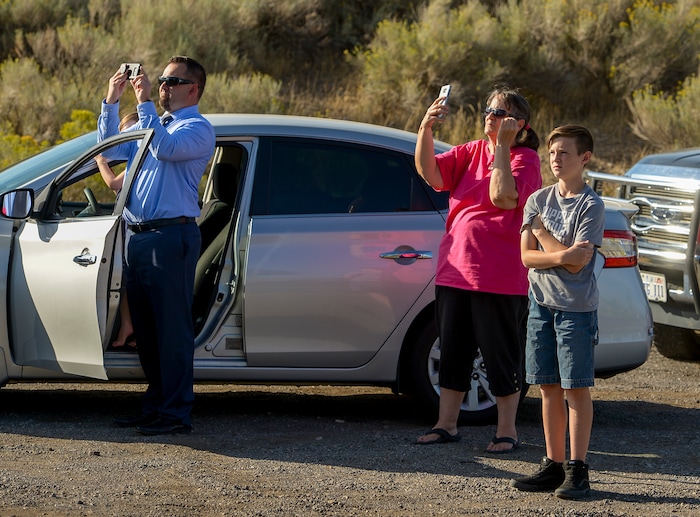 Leah Hogsten  |  The Salt Lake Tribune   Homeowners who were not allowed to return to their homes and onlookers waited near Herriman Cove pond and park.   A 50-acre wildfire in Rose Canyon was threatened about a half-dozen homes Wednesday, Sept. 12, 2018. A spokesman for Unified Fire said the blaze has already burned a few structures, including outhouses and sheds. Firefighters have evacuated around 20 to 30 homes in two neighborhoods near 15555 S. Rose Canyon Road in Herriman. 