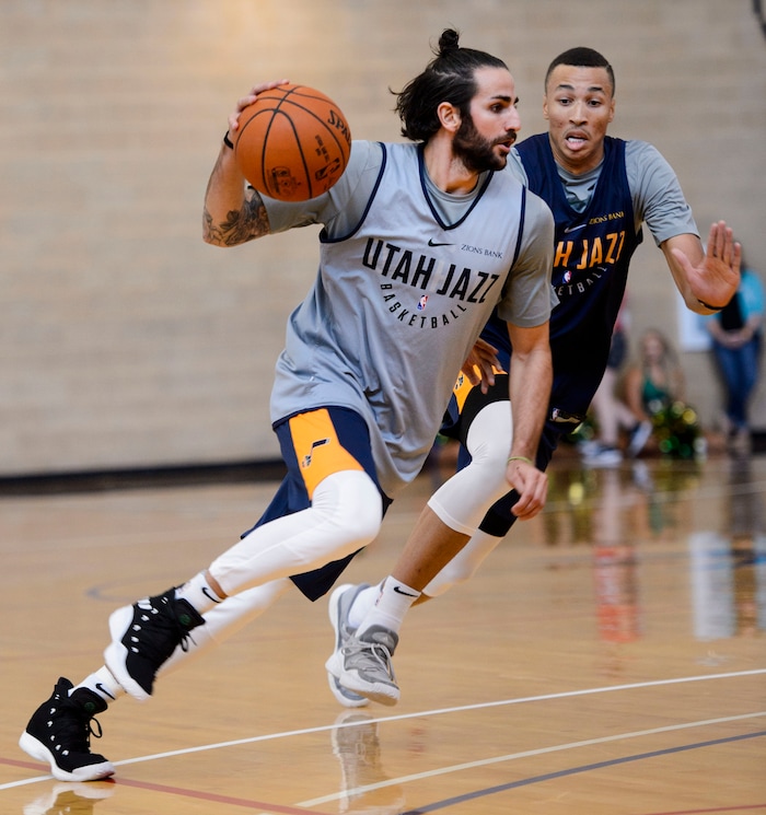 (Steve Griffin  |  The Salt Lake Tribune)    New Jazz guard Ricky Rubio drives past Utah Jazz guard Dante Exum (11) in the Warrior Fitness Center on Hill Air Force Base as they scrimmage as a part of a "Hoops for Troops" promotion Ogden Friday September 29, 2017. It's also Utah's first public scrimmage of the season, and the first look at how the new pieces of the team will work together. 