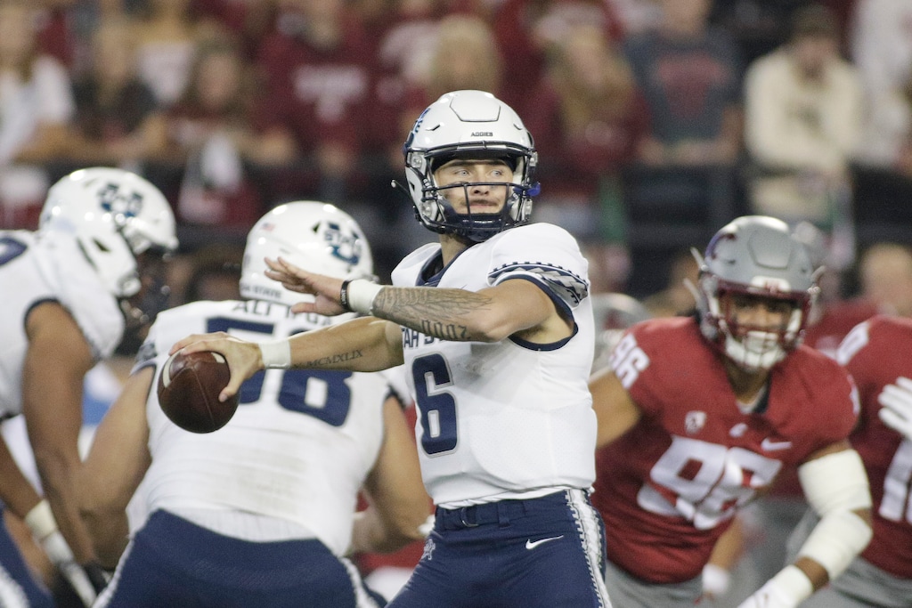 (Young Kwak | AP) Utah State quarterback Andrew Peasley prepares to throw a pass during the second half of an NCAA college football game against Washington State, Saturday, Sept. 4, 2021, in Pullman, Wash.