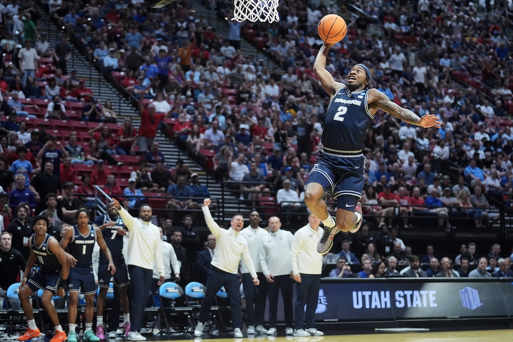 (Marcio Jose Sanchez | AP) Utah State guard MJ Collins (2) dunks against Villanova during the second half in the first round of the NCAA Tournament.