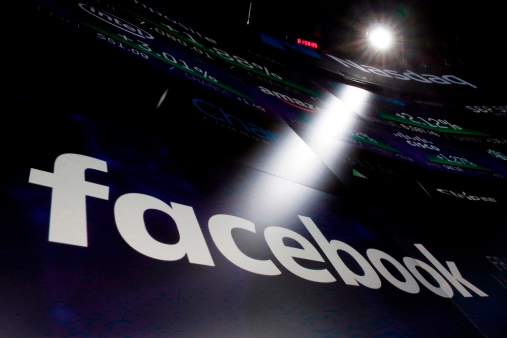 (Richard Drew | The Associated Press) In this March 29, 2018, file photo the logo for Facebook appears on screens at the Nasdaq MarketSite in New York's Times Square. Many companies large and small are updating their privacy policies and service terms to comply with upcoming European Union rules governing data and privacy. In preparation for GDPR, Facebook in March updated its privacy controls in hopes of making them easier to find and understand.
