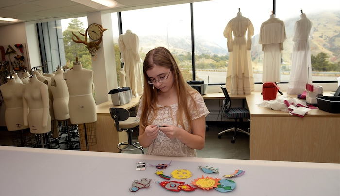 (Al Hartmann  |  The Salt Lake Tribune) 	
Utah State University is getting ready to reopen the renovated Chase Fine Arts Center, an arts complex that includes the totally remodeled Daines Concert Hall.  Callie Lythgoe, a sophomore in costume design works on a project in the newly remodeled costume shop.  