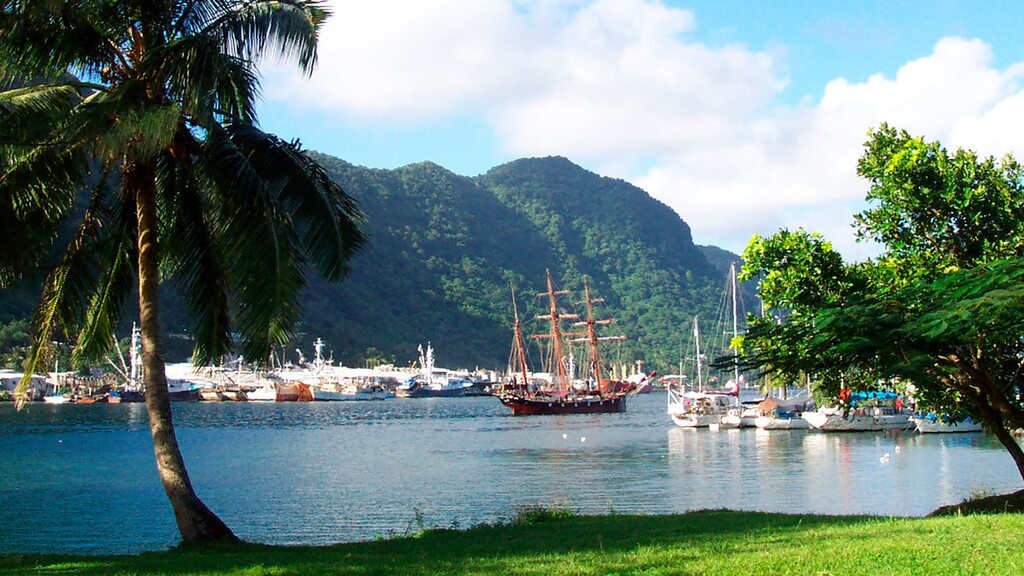 (David Briscoe  |  The Associated Press) This July 2002 file photo shows a sailing ship in the harbor at Pago Pago, American Samoa. Many residents of American Samoa were concerned that a federal judge's recent ruling in Utah, saying those born in the U.S. territory should be recognized as U.S. citizens, would threaten "fa'a Samoa," the Samoan way of life. On Tuesday, June 15, 2021, the decision was reversed by the 10th Circuit Court of Appeals in Denver.