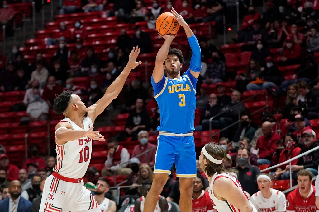 (Rick Bowmer | AP) UCLA guard Johnny Juzang (3) shoots as Utah guard Marco Anthony (10) defends during the first half Thursday.