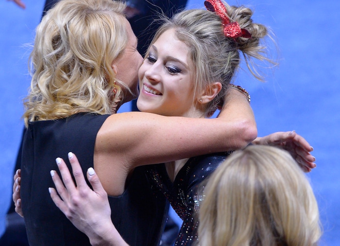 Leah Hogsten  |  The Salt Lake TribuneUtah's Sabrina Schwab is hugged by coach Megan Marsden after she took first place in floor exercise with a score of 9.925. University of Utah No. 6 gymnasts defeated  No. 11 Oregon State during their Pac-12 meet in Salt Lake City, January 23, 2016. 