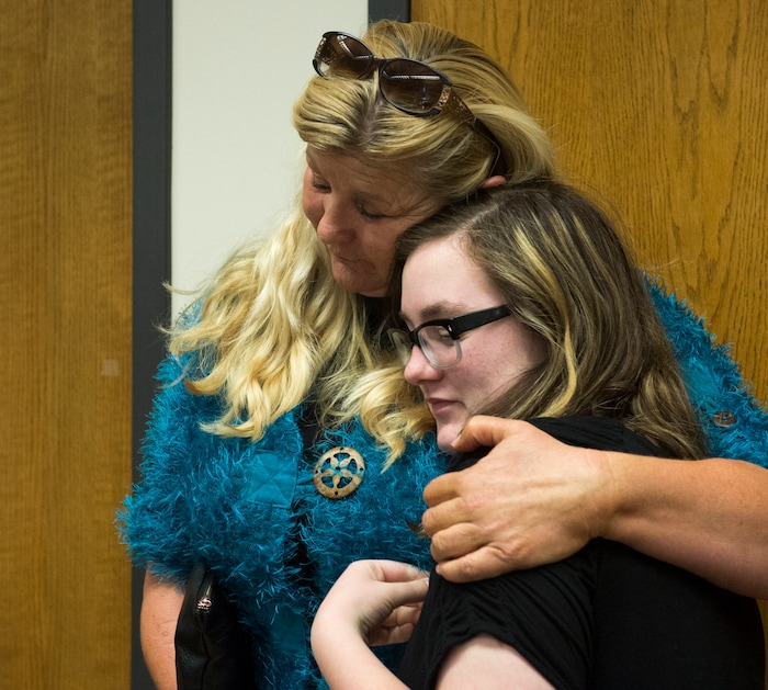 (Rick Egan  |  The Salt Lake Tribune)       Nikka Powell, Riley's sister, gets a hug from a family member, after attending a hearing, as Jerrod Baum appeared for a hearing in the 4th District Court, in Provo, Thursday, April 26, 2018.  Baum is accused of killing 18-year-old Riley Powell and 17-year-old Brelynne “Breezy” Otteson in December and dumping their bodies into an abandoned mine shaft.



