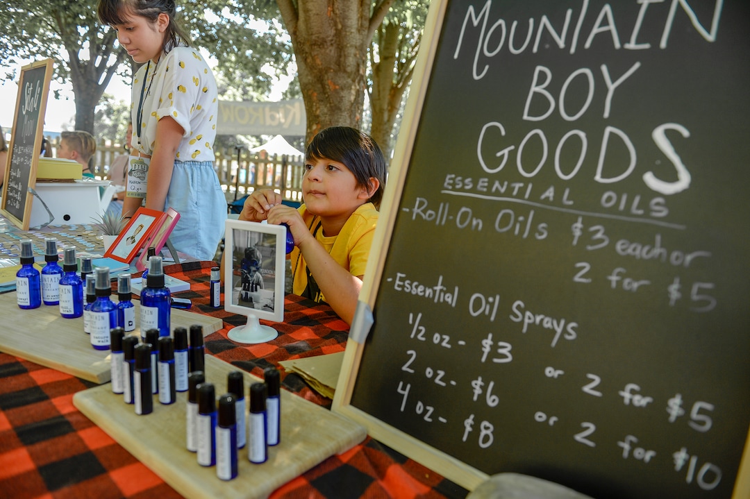 (Leah Hogsten  |  The Salt Lake Tribune)  l-r Qiya Alandia, 11, sells custom art buttons under the name Sitali Moon next to her brother Gyan Alandia, 8, who sells essential oil products under the name Mountain Boy Goods at the Craft Lake City DIY Festival Kid Row, where children 14 and under make and sell their products. Craft Lake CityÕs DIY Festival is UtahÕs largest local, three day arts festival with over 300 artisans, DIY engineers, vintage vendors and craft food creators.